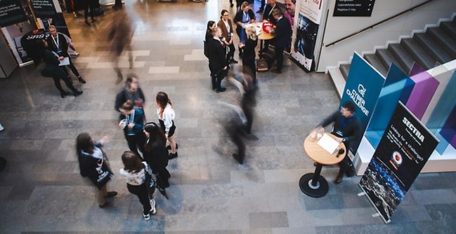 People talking to each other in the entrance hall at the SEDU.